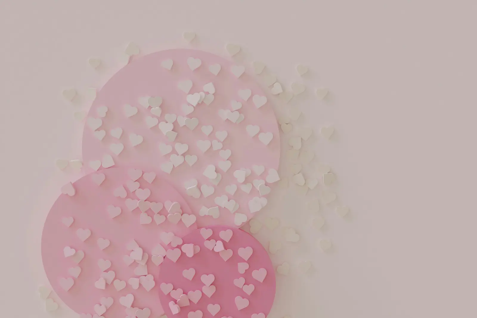 a pink and white paper cut out of hearts
