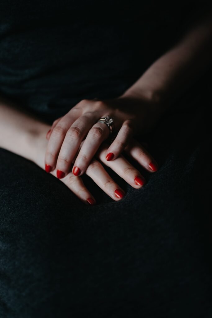 Woman's hands with polished nails and a ring