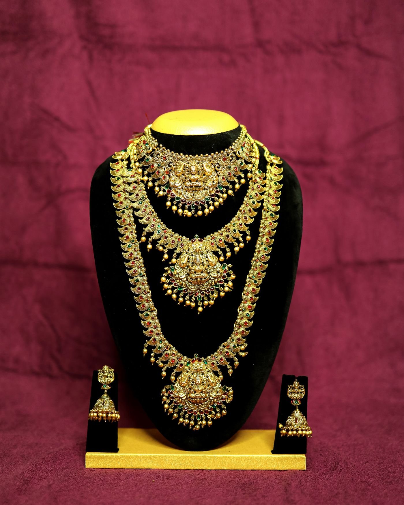 Illustrative fine jewelry set arranged on a light surface