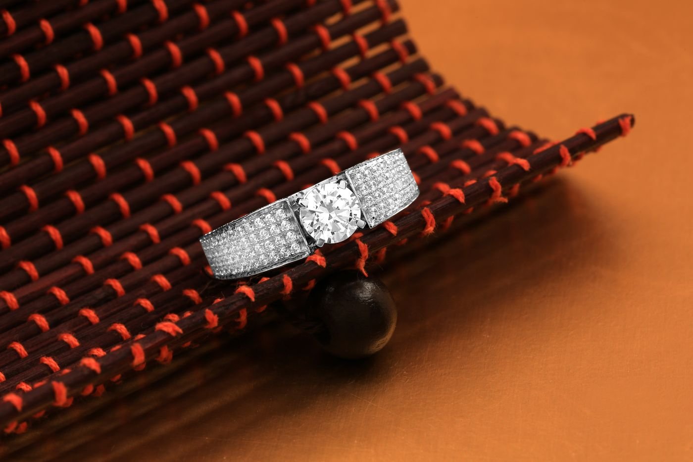 Illustrative diamond ring photographed on a light marble surface