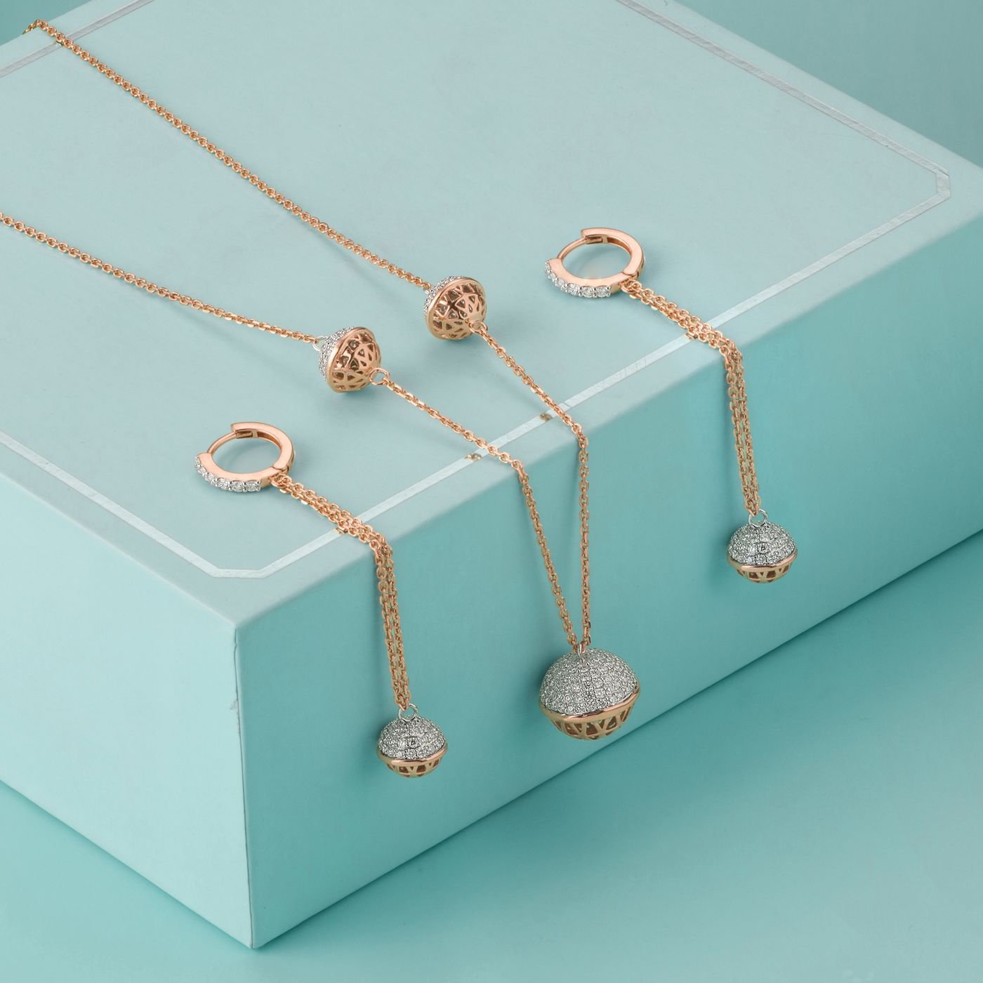 Brilliant Earth Review: What to Know Before Buying a Diamond 4 Illustrative gold and silver jewelry set on a colored surface